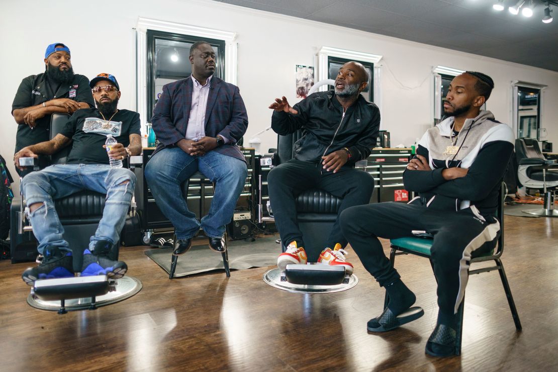 Aaron Bethea, second from right, speaks during a discussion about voting with other Black men at Anytime Cutz barbershop.