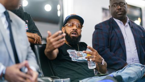 Hawkins gestures while speaking about voting at Anytime Cutz.