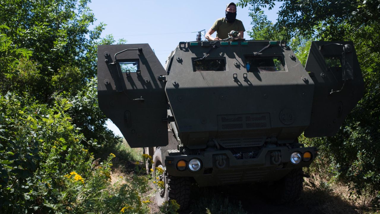 A Ukrainian serviceman as seen on a US-provided HIMARS artillery piece on July 1, 2022 in Eastern Ukraine.