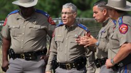 UVALDE, TEXAS - MAY 30: Steven C. McCraw, Director and Colonel of the Texas Department of Public Safety (2nd L), speaks with DPS State Troopers near Robb Elementary School on May 30, 2022 in Uvalde, Texas. Visitations for Amerie Jo Garza and Maite Rodriguez, two of the 19 children killed in the May 24th Robb Elementary School mass shooting are being held today. Wakes and funerals for the 21 victims will be scheduled throughout the week. (Photo by Michael M. Santiago/Getty Images)
