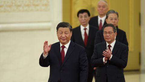 The seven new members of the Politburo Standing Committee of the Communist Party attend a meeting with Chinese and foreign journalists on October 23 in Beijing.