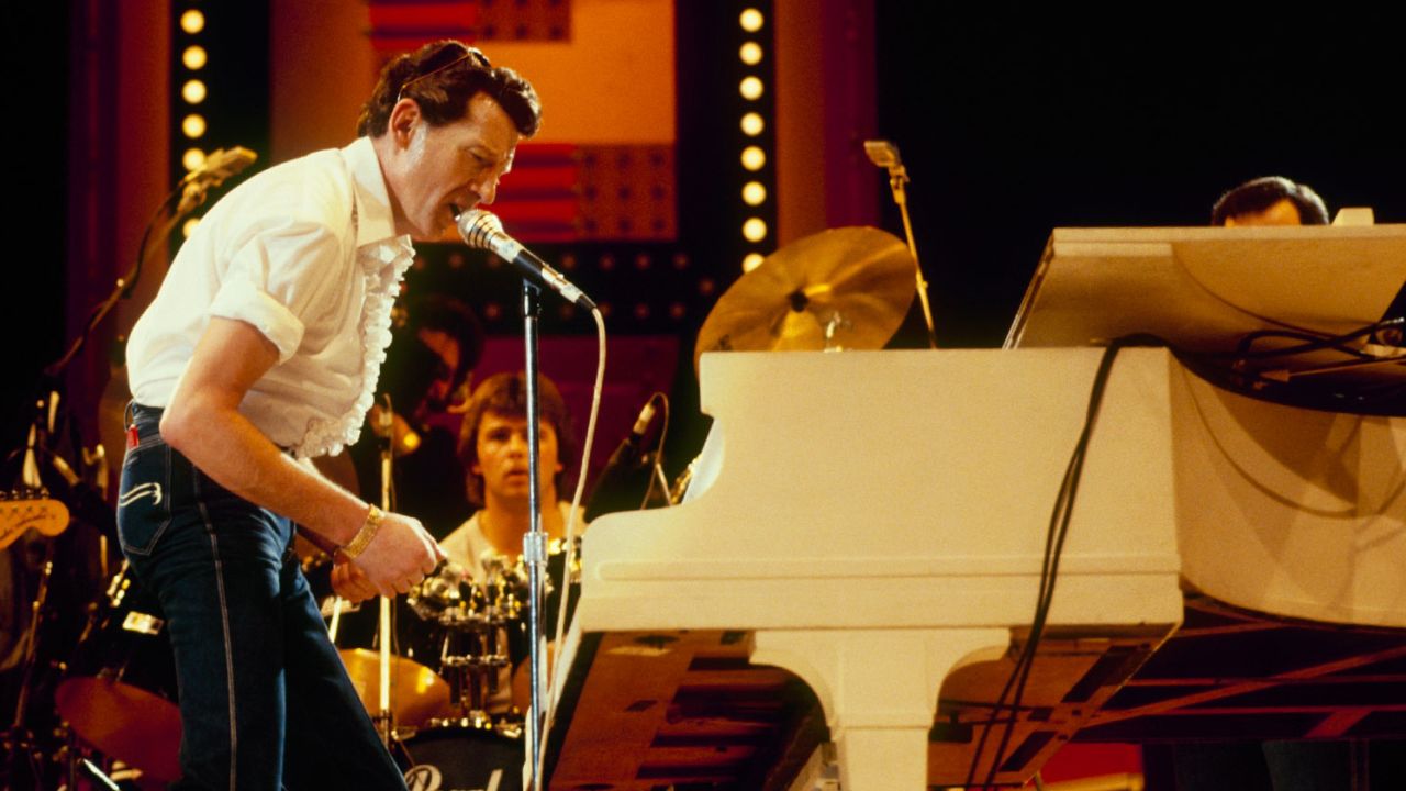 Jerry Lee Lewis performs on stage at the Country Music Festival held at Wembley Arena, London in April 1982.