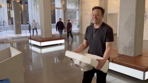 Elon Musk on Wednesday posted a video showing him entering Twitter's headquarters carrying a sink. His deal to buy the company is expected to close by Friday. 