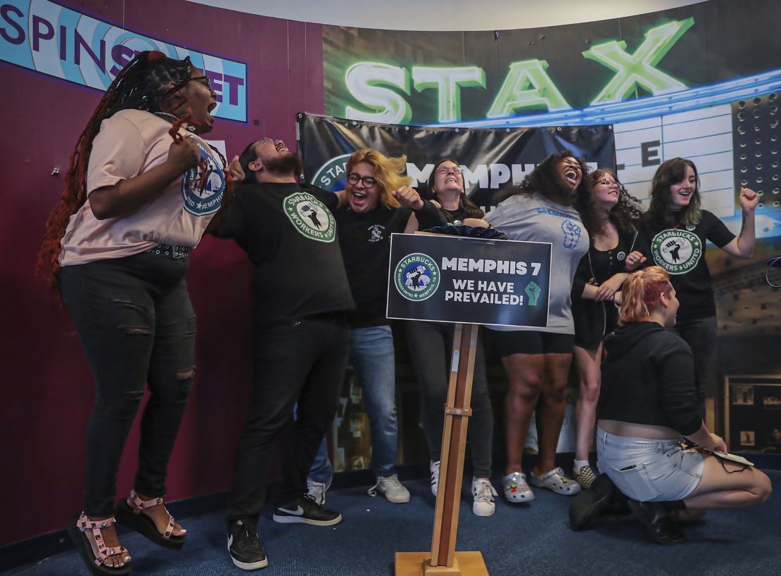 Members of the Memphis Seven, including Nabretta Hardin (far left) celebrate a vote to unionize their local Starbucks location in Memphis.