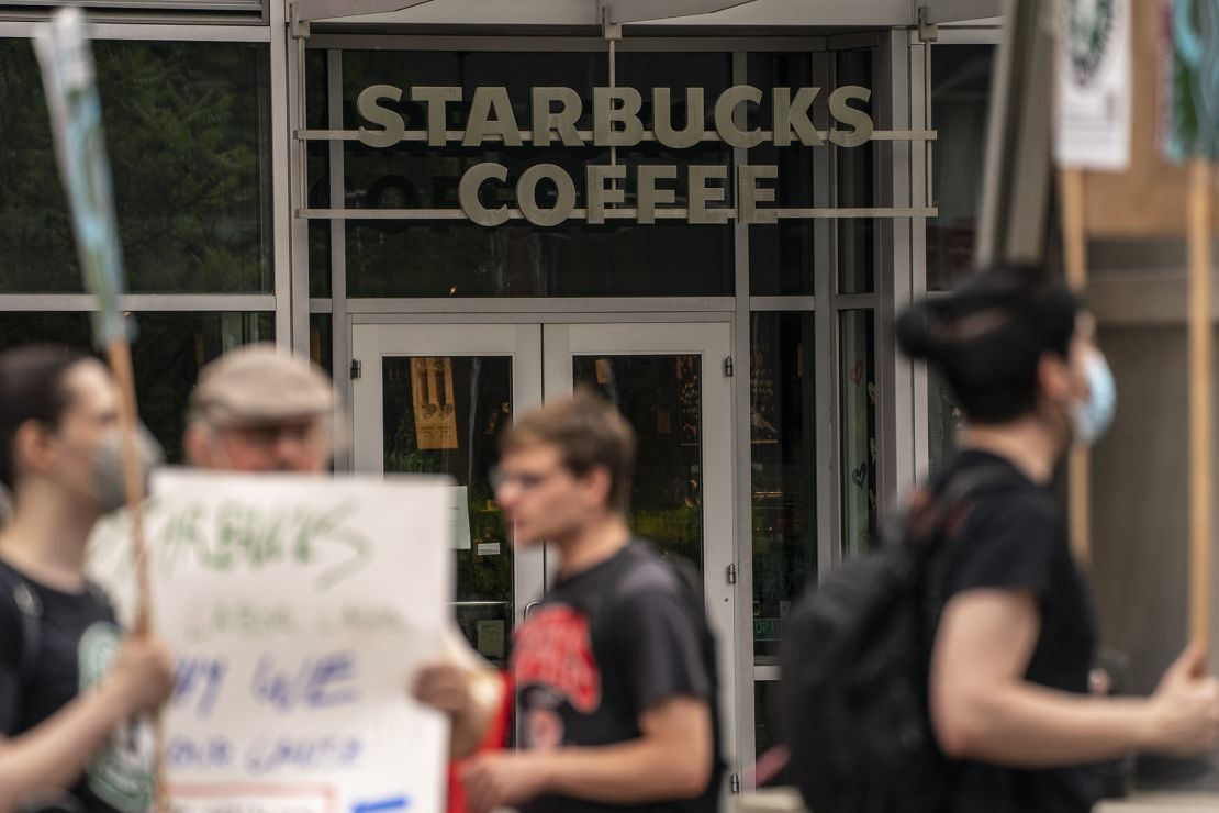 Demonstrators protest outside a closed Starbucks location in Seattle in July.