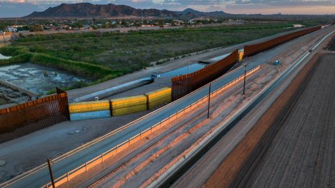 This aerial photo taken September 27 shows shipping containers filling a gap in the US-Mexico border wall in Yuma, Arizona. 
