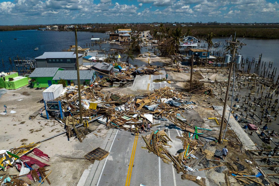 Debris and destroyed houses are seen along a broken section of road  in Matlacha, Florida, on October 1, following Hurricane Ian.