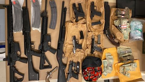 A Justice Department handout photo shows some of the firearms recovered during the arrests.