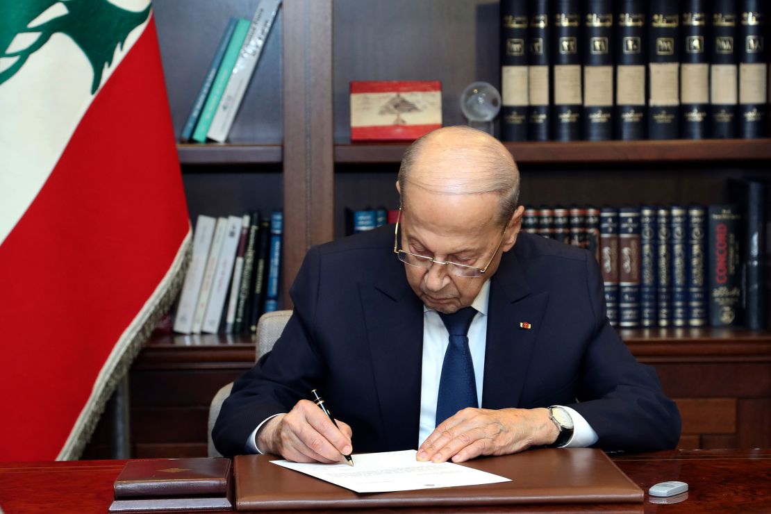 Lebanese President Michel Aoun signs the US-brokered deal setting a maritime border between Lebanon and Israel, at the presidential palace in Beirut.