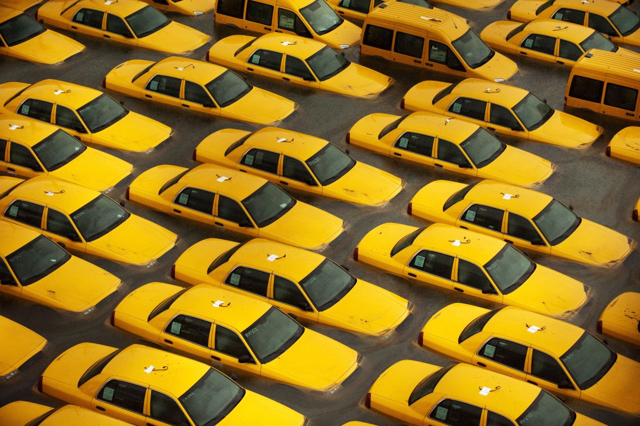 Taxis sit in a flooded lot in Hoboken, New Jersey, on October 30, 2012, the day after Sandy made landfall.