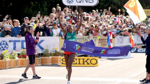 Gebreslase breaks the tape at the World Athletics Championships.
