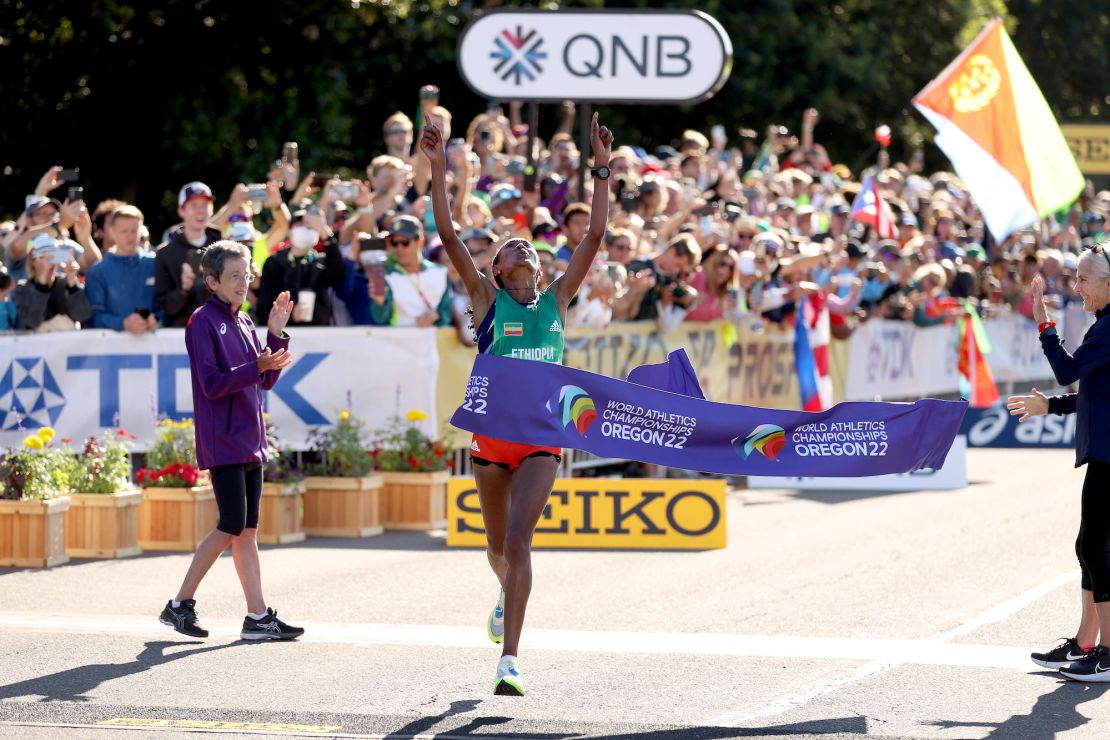 Gebreslase breaks the tape at the World Athletics Championships. 