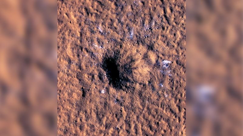 Space rock slams into Mars, revealing buried ice