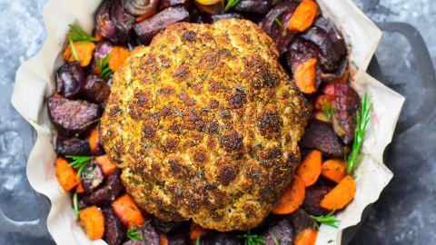 A whole roasted cauliflower can make a picturesque plant-based centerpiece dish for Thanksgiving.