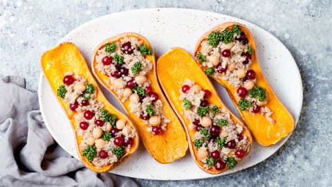 Help decolonize your menu by serving stuffed butternut squash with chickpeas, cranberries and quinoa.