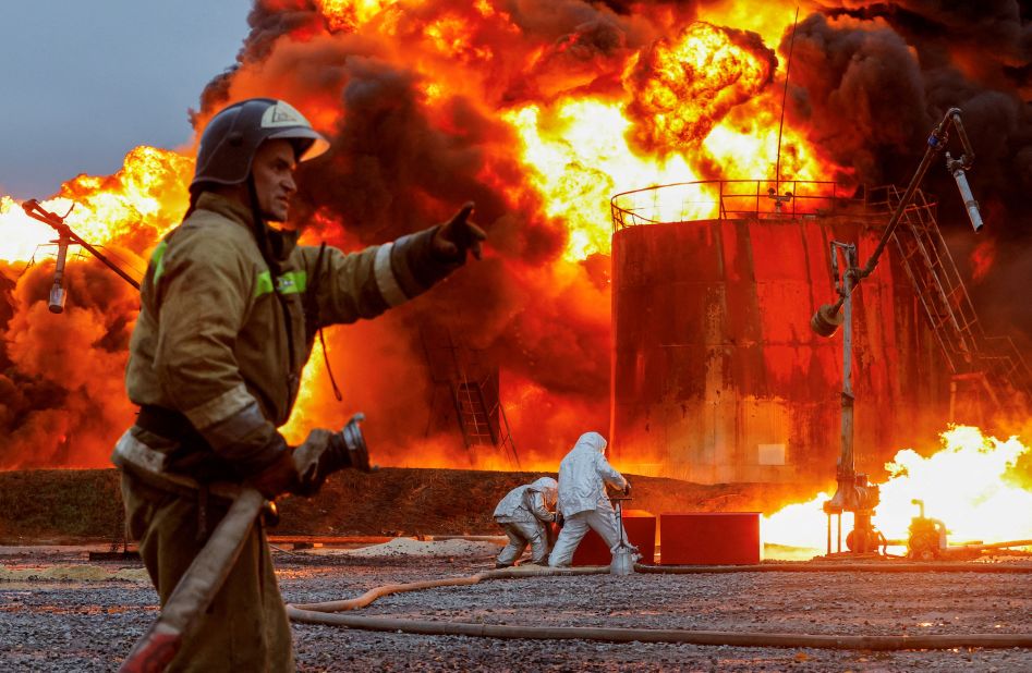 Firefighters work at an oil storage facility that was shelled in Shakhtarsk, a town in Russian-controlled Ukraine, on Thursday, October 27.