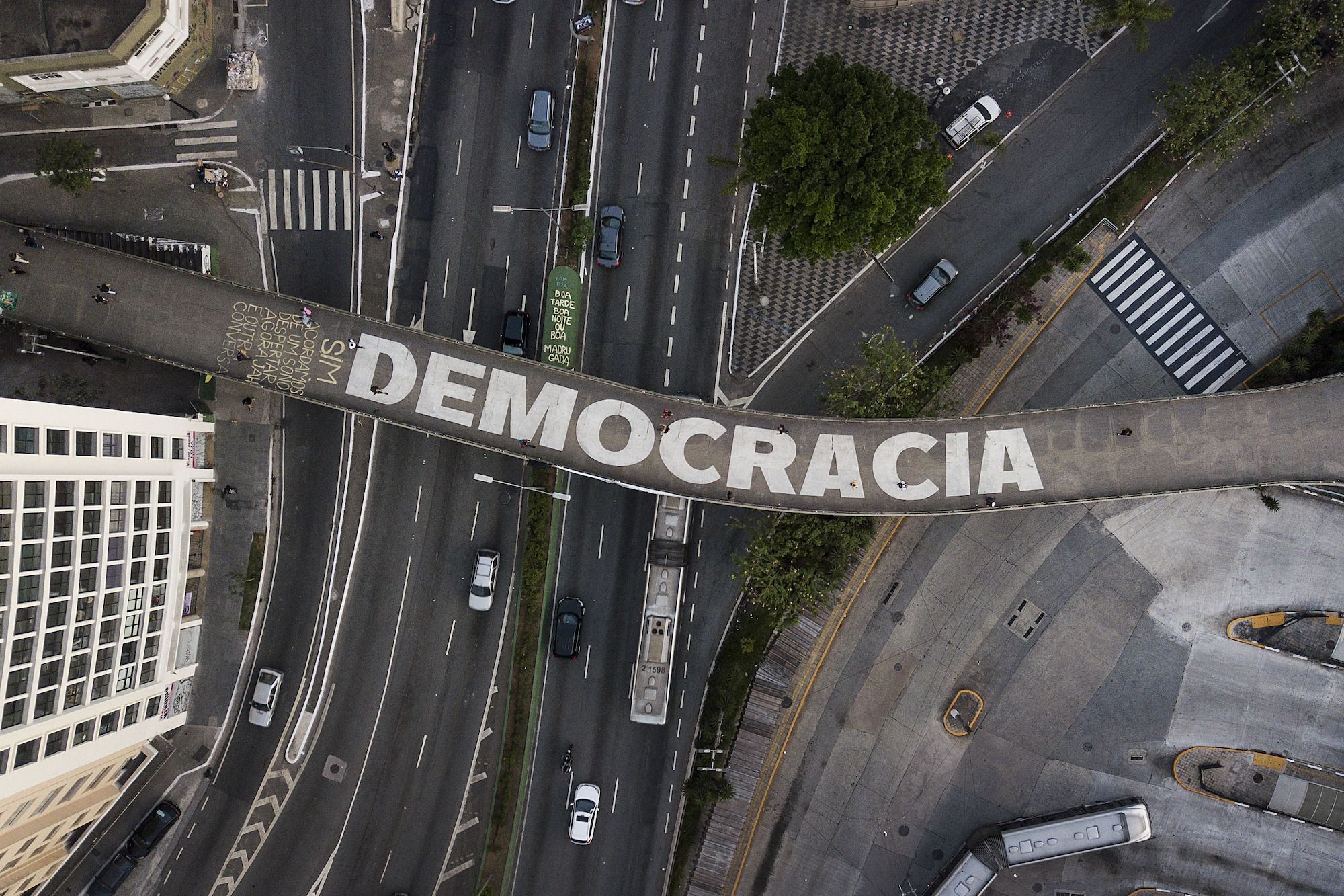 The Portuguese word for democracy is written on a pedestrian bridge in São Paulo, Brazil, on Wednesday, October 26.