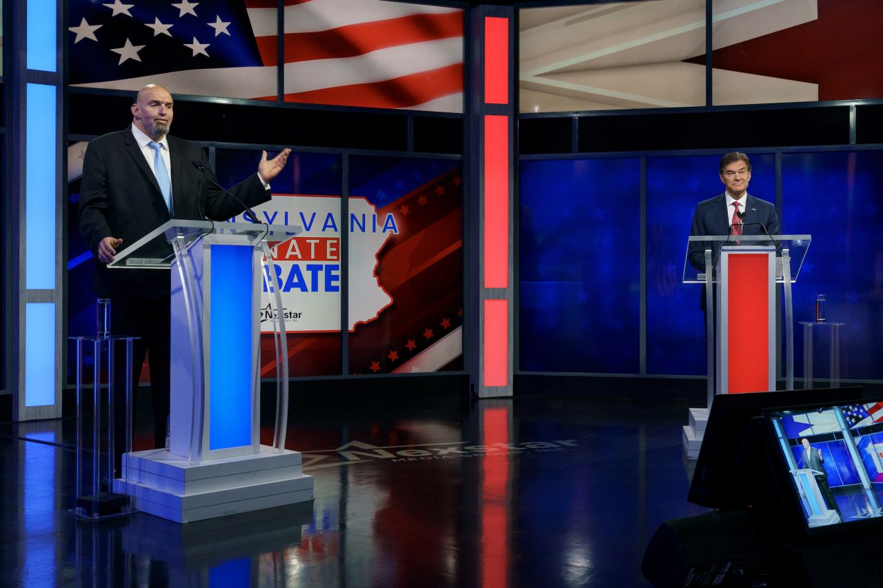 Pennsylvania Lt. Gov. John Fetterman, left, <a href="https://www.cnn.com/2022/10/25/politics/fetterman-oz-debate-pa-senate-takeaways/index.html" target="_blank">debates Mehmet Oz</a> in Harrisburg, Pennsylvania, on Tuesday, October 25. Both men are running for the US Senate, and the tight race <a href="https://www.cnn.com/2022/10/27/politics/senate-race-surprises-pennsylvania-georgia-analysis/index.html" target="_blank">could decide which party controls the Senate</a> after the midterm election.