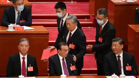 Former Chinese leader Hu Jintao pats the shoulder of his protege, Premier Li Keqiang.