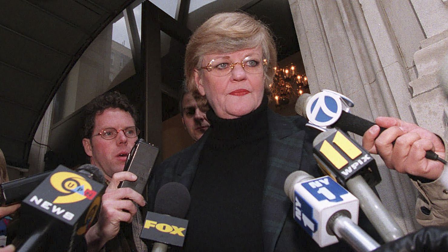 New York literary agent Lucianne Goldberg addresses a large assembly of media outside her apartment on January 24, 1998, in New York. 