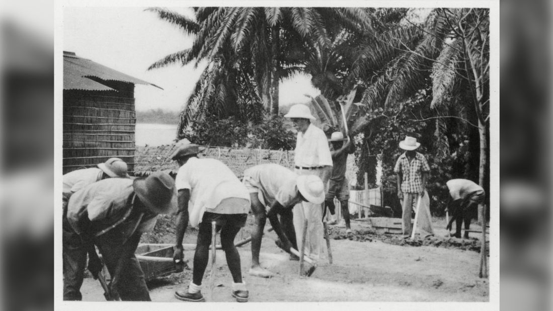 Many colonial-era postcards showed missionary work. Pictured, French missionary physician Albert Schweitzer supervising the building of new huts in Lambaréné, Gabon.