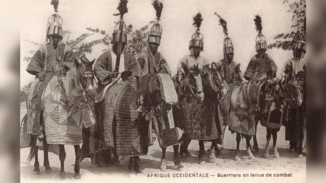 This undated postcard shows Bornu warriors in ceremonial battle dress. The Bornu Empire (1380-1893) encompassed territory that's now part of Nigeria, Niger, Chad and Cameroon.
