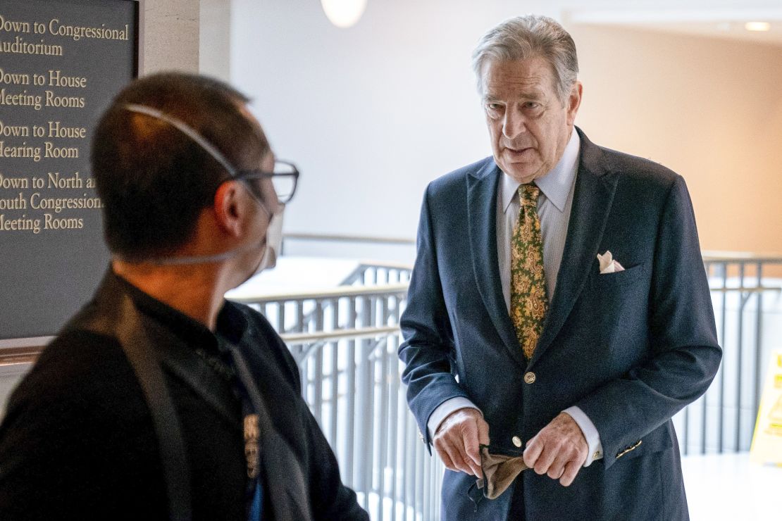 Paul Pelosi, right, the husband of House Speaker Nancy Pelosi, of California, follows his wife as she arrives for her weekly news conference on Capitol Hill in Washington on March 17, 2022. 