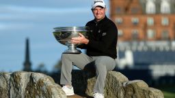 ST ANDREWS, SCOTLAND - OCTOBER 02: Ryan Fox of New Zealand poses with the trophy on the Swilcan Bridge on the 18th hole after winning the Alfred Dunhill Links Championship on the Old Course St. Andrews on October 02, 2022 in St Andrews, Scotland. (Photo by Richard Heathcote/Getty Images)