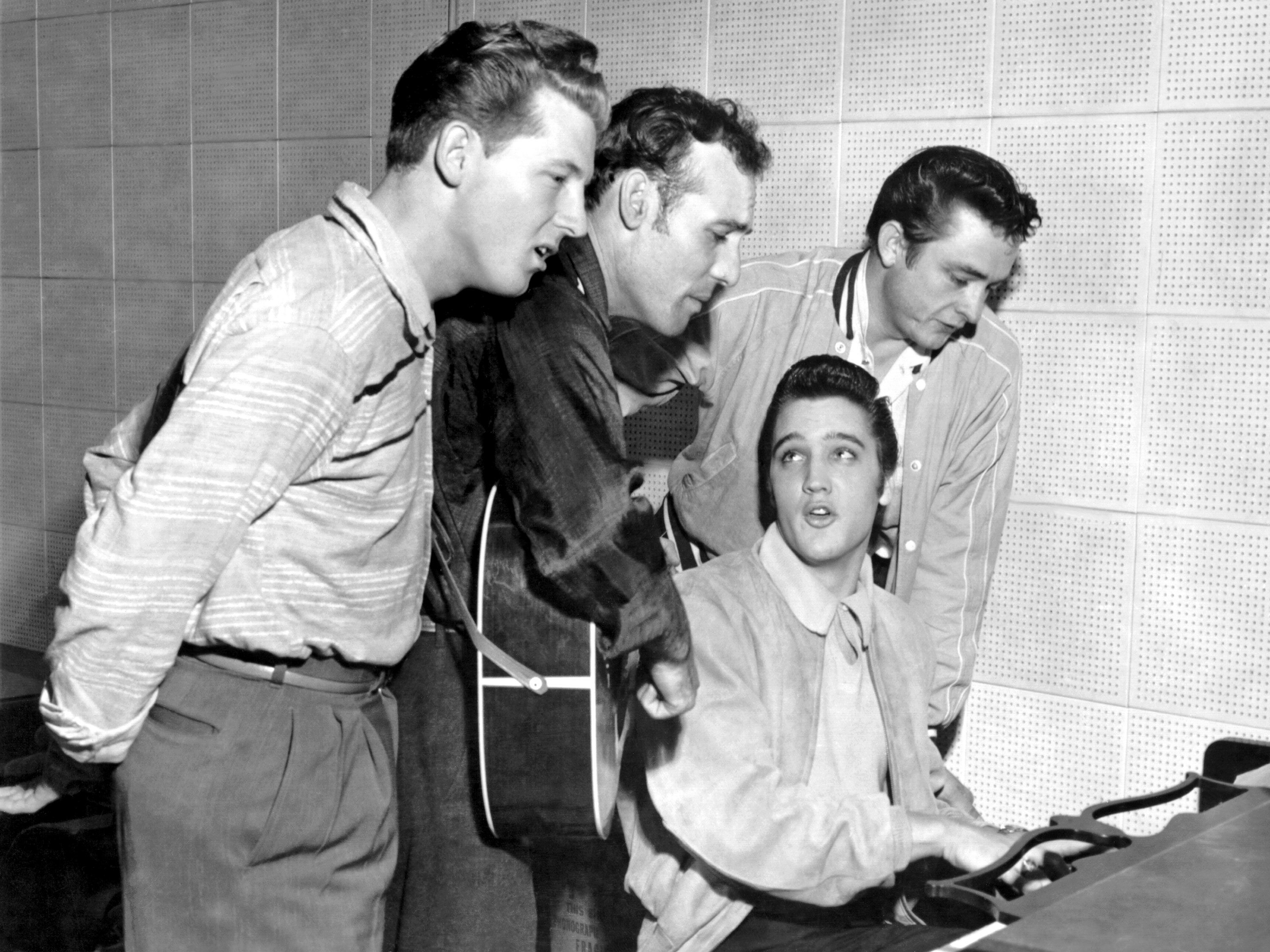 From left, Lewis joins Carl Perkins, Elvis Presley and Johnny Cash for a one-night jam session in Memphis, Tennessee, in 1956.