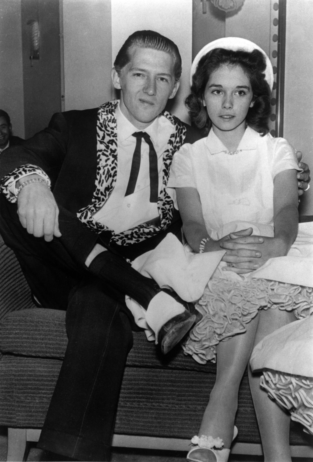 Lewis is seen with his third wife, Myra, in 1958. He was near the peak of his popularity when the public learned that he had married Myra Gale Brown, his first cousin. She was 13 at the time; Lewis was 22. News of the marriage leaked in London, where Lewis had flown to play some concerts. Lewis told the press that Myra was 15, but the truth soon came out and caused an outcry, as newspapers blared such headlines as "Fans Aghast at Child Bride." Audiences heckled Lewis, and the tour was canceled after three shows. 