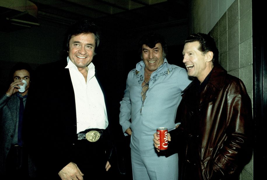 From left, Cash, Perkins and Lewis hang out together at a show in Madison, Wisconsin, in 1982. After a decade of dwindling sales, Lewis reinvented himself in the late 1960s as a country artist and revived his career.