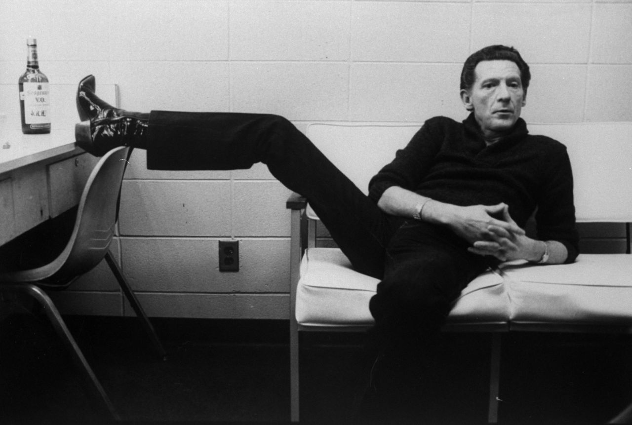 Lewis lounges on a couch inside a dressing room in 1982.