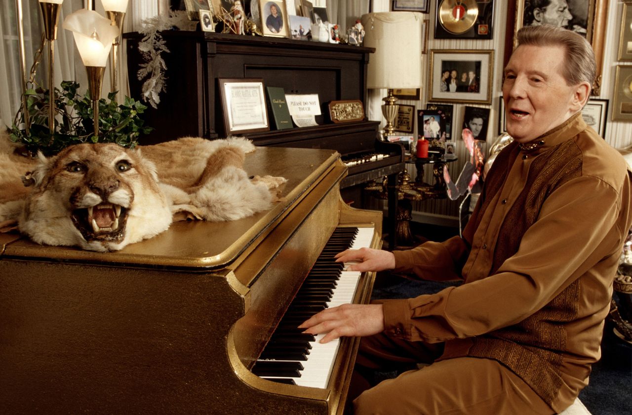 Lewis plays the piano at his home in Mississippi in 1999.