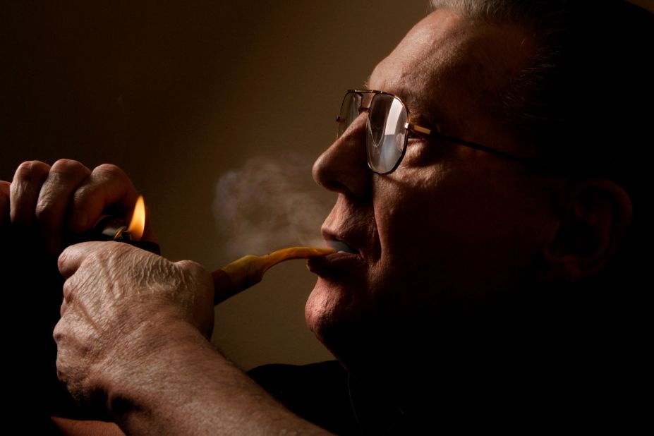 Lewis lights his favorite pipe in his dressing room backstage in Highland, California, in 2005.