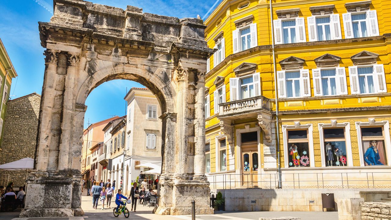 An ancient Roman arch stands in a sunny square in Pula, Croatia -- a worthy alternative to crowded Dubrovnik.