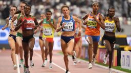 Kenya's Faith Kipyegon (L), USA's Nikki Hiltz (C) and Netherlands' Sifan Hassan (2nd R)  compete in the Women's 1500m heats at the 2019 IAAF Athletics World Championships at the Khalifa International stadium in Doha on October 2, 2019. (Photo by Jewel SAMAD / AFP) (Photo by JEWEL SAMAD/AFP via Getty Images)