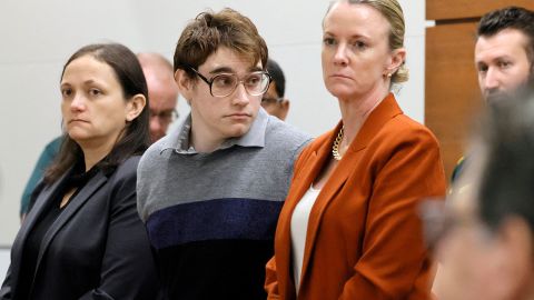 Parkland school shooter Nikolas Cruz stands October 13 with members of his defense team at the Broward County Courthouse in Florida. 