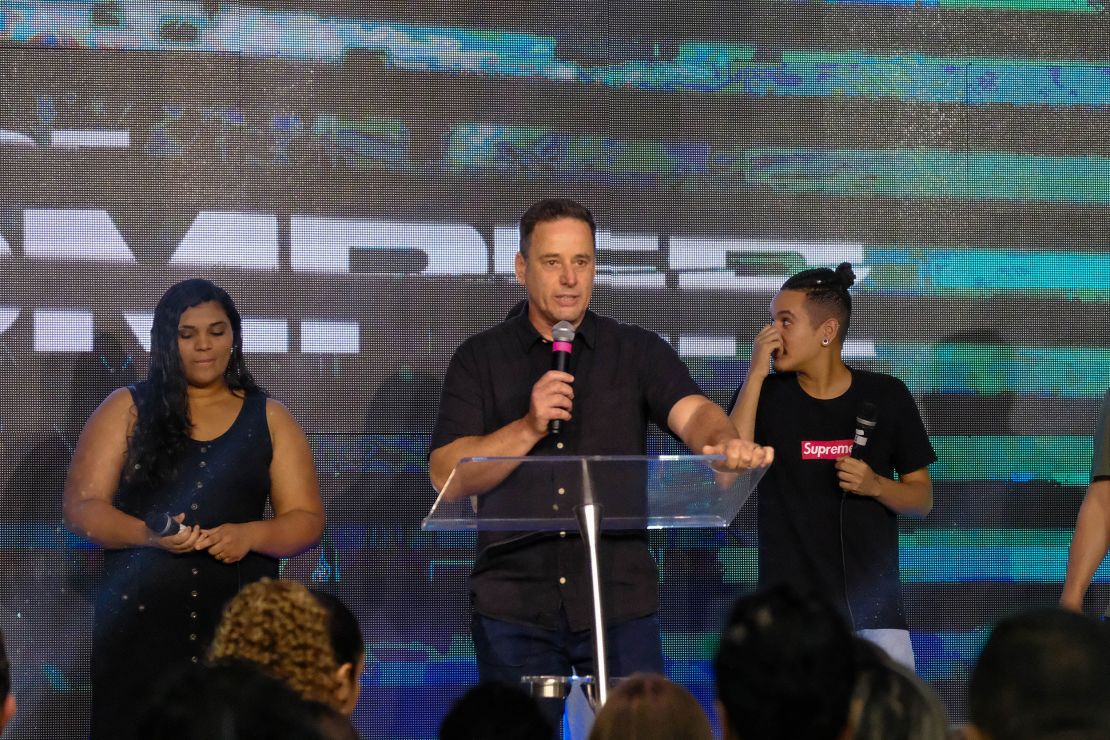 Pastor Odilon Santos prays with his congregation. Churches like his have become increasingly political.