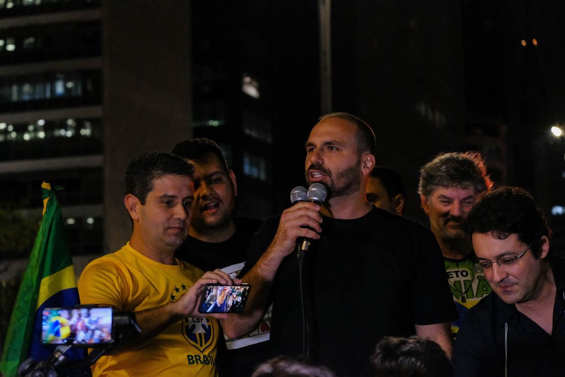 Lawmaker Eduardo Bolsonaro addresses a 'free speech rally' in São Paulo.