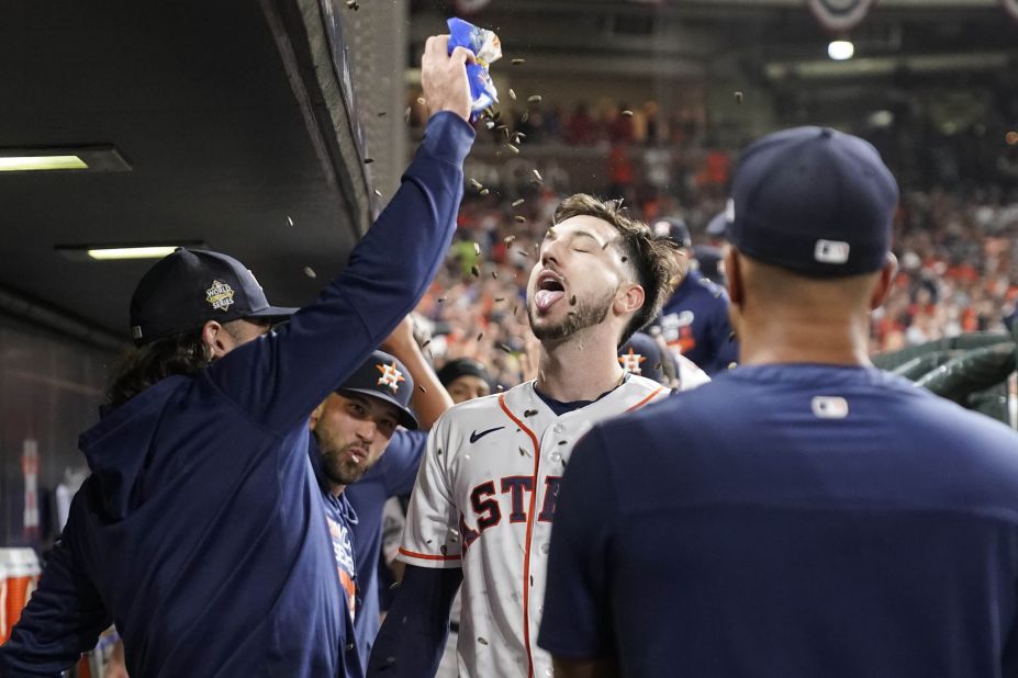 Tucker celebrates in the dugout after hitting his second home run of the night to give the Astros a 5-0 lead in the third inning.