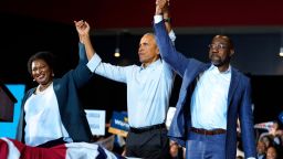 Former President Barack Obama, center, stands with Georgia gubernatorial candidate Stacey Abrams and candidate for U.S. Senate, Sen. Raphael Warnock D-Ga., during a campaign rally Friday, Oct. 28, 2022, in College Park, Ga. (AP Photo/John Bazemore)