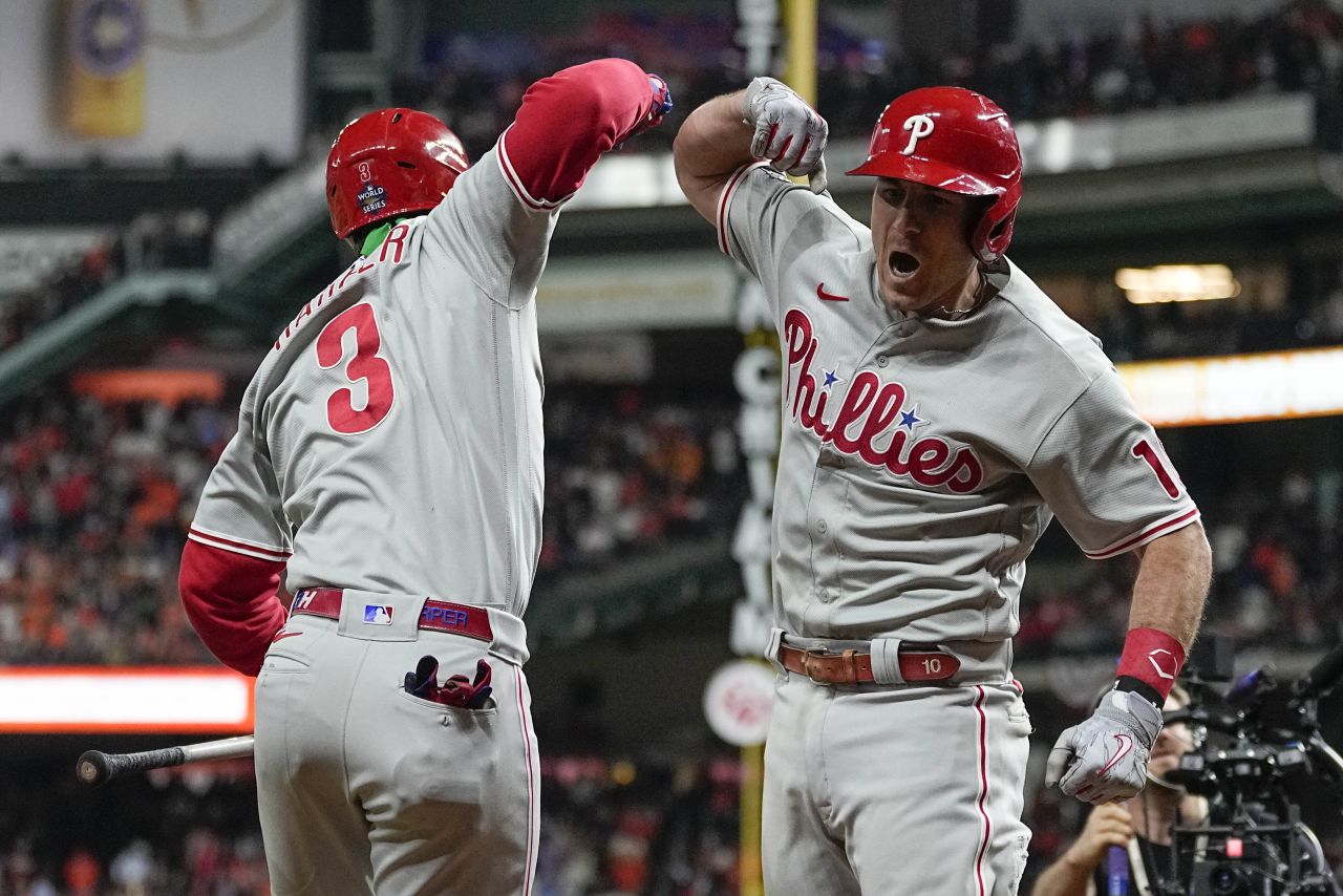 Realmuto, right, celebrates his homer with Harper.