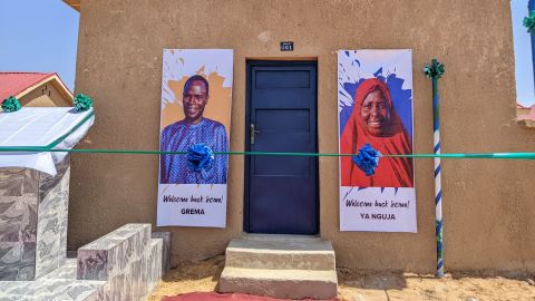 Residents are welcomed home with posters on their buildings.