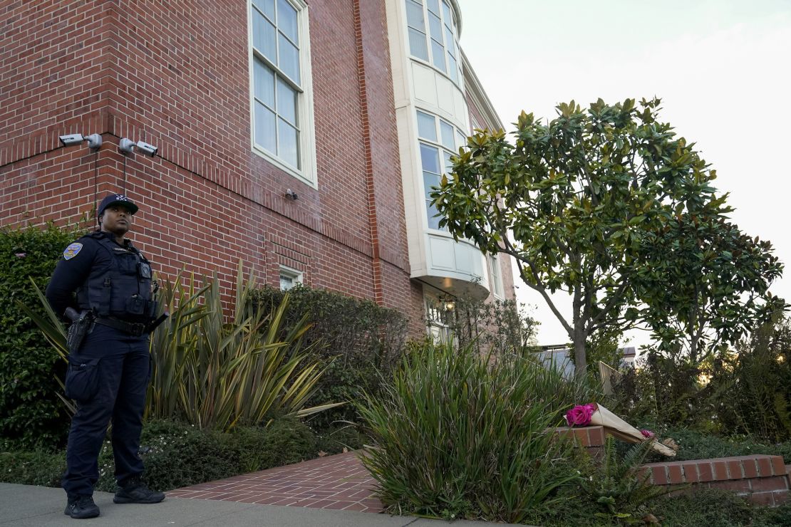 A police officer stands outside the home of Nancy and Paul Pelosi in San Francisco on October 28, 2022.