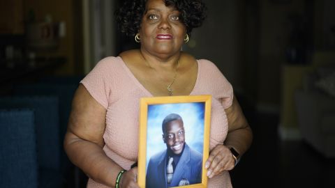 Diane Wilson holds a photo of her son Tyrell Wilson.