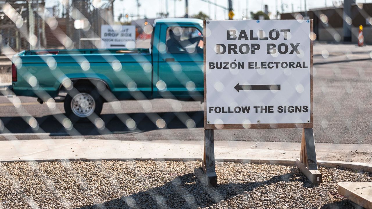 Fences surround the Maricopa County Tabulation and Elections Center in Phoenix on October 25, 2022, to help prevent incidents and pressure on voters at the ballot drop box.