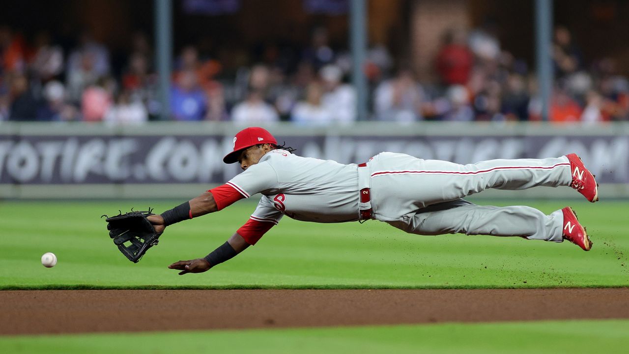 Edmundo Sosa of the Philadelphia Phillies is unable to make a catch in the fourth inning.