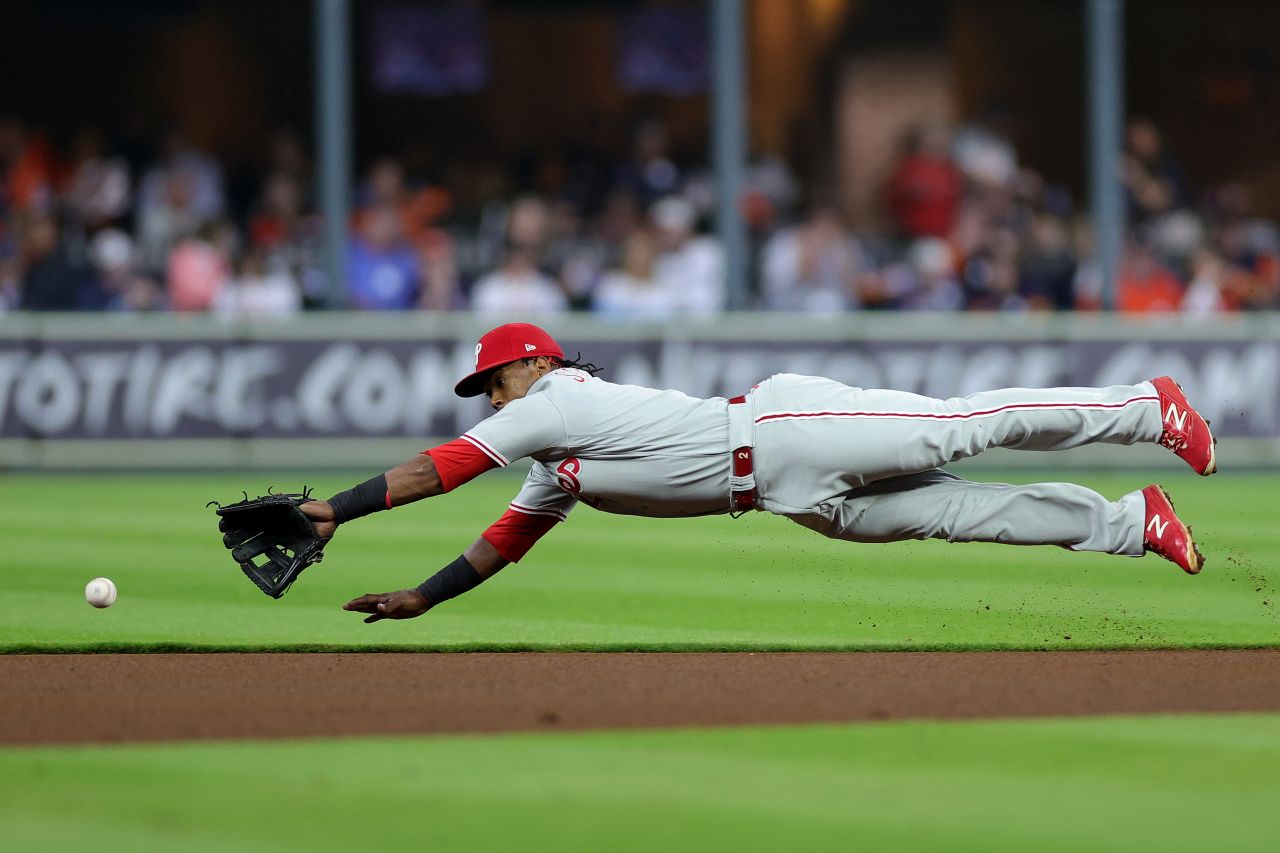 Philadelphia's Edmundo Sosa dives for a ball but is unable to make the play in Game 2.
