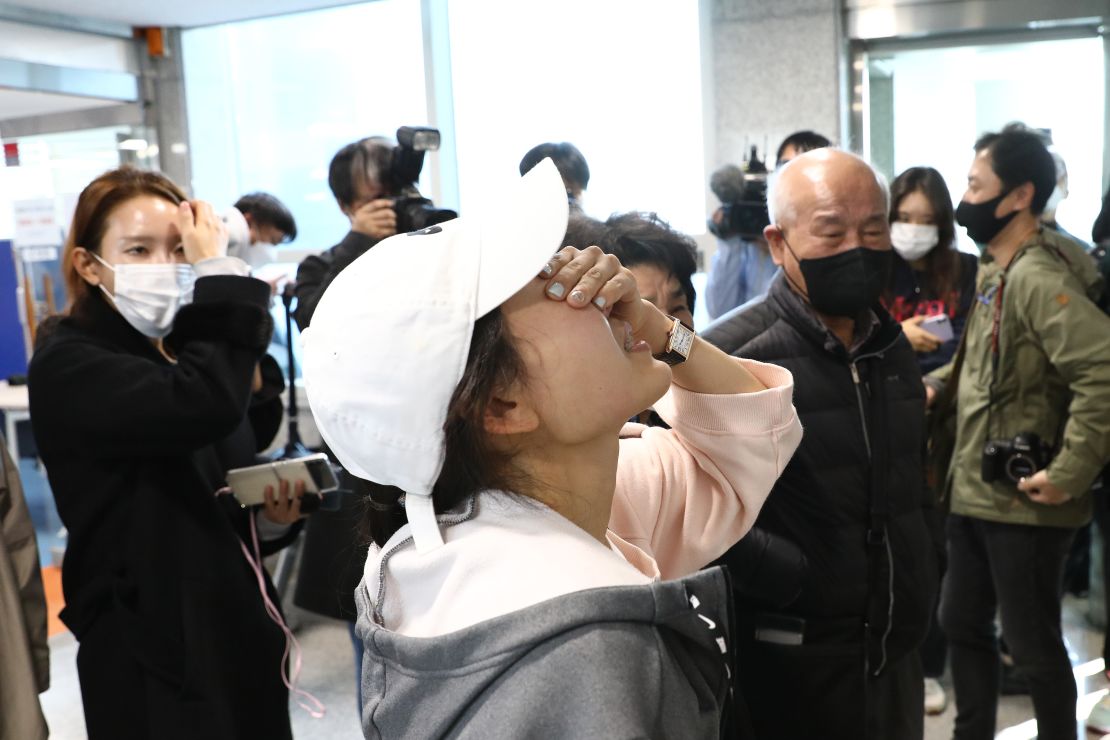 Relatives of missing people weep at a community service center on October 30, 2022 in Seoul, South Korea. 