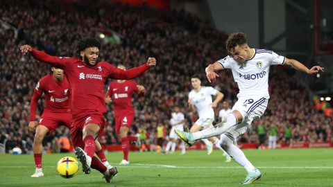 Rodrigo Moreno shoots while under pressure from Liverpool's Joe Gomez.